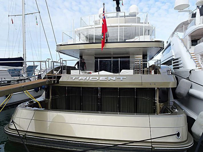 a boat docked at a pier aboard TRIDENT Yacht for Sale