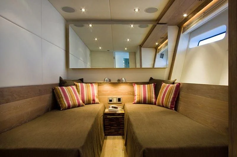 a room with couches and a bed aboard AHT Yacht for Sale