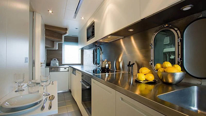 a kitchen with a large mirror aboard AHT Yacht for Sale