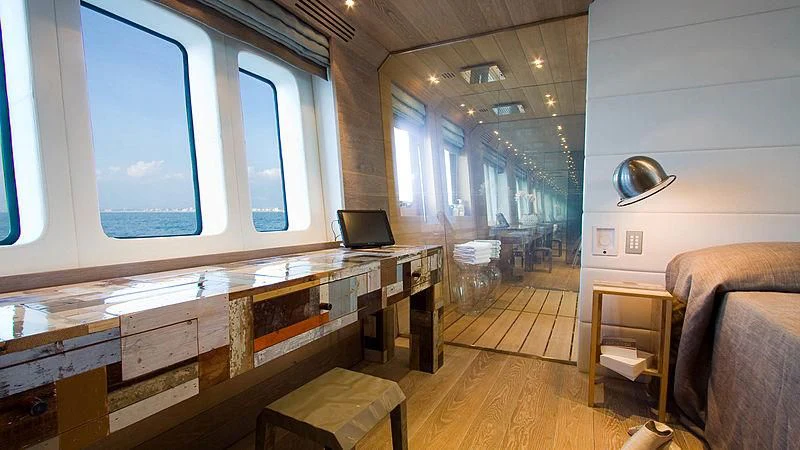 a room with a desk and a laptop aboard AHT Yacht for Sale