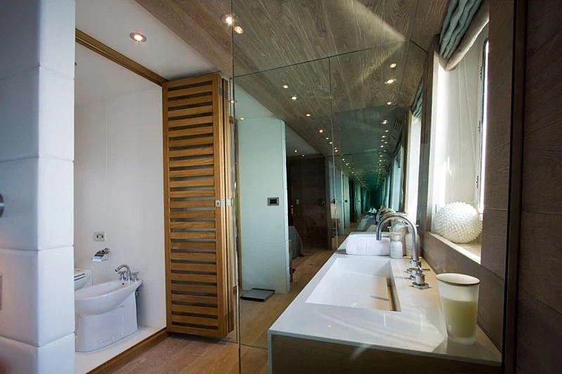 a bathroom with a glass shower aboard AHT Yacht for Sale