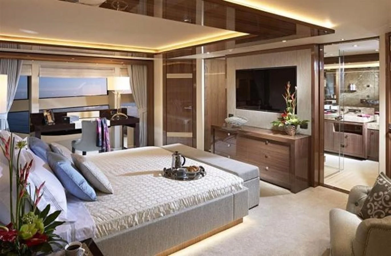 a bedroom with a large bed aboard ZOZO Yacht for Sale
