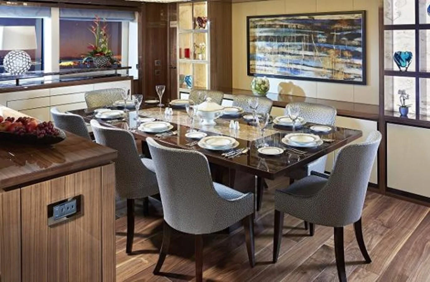 a large dining table with plates and chairs aboard ZOZO Yacht for Sale