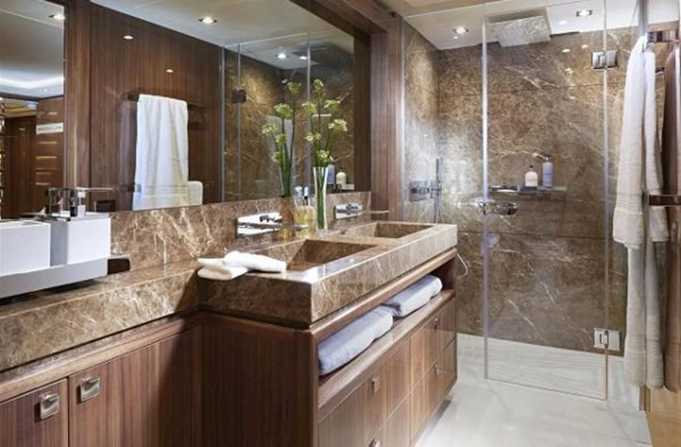 a bathroom with a large mirror aboard ZOZO Yacht for Sale