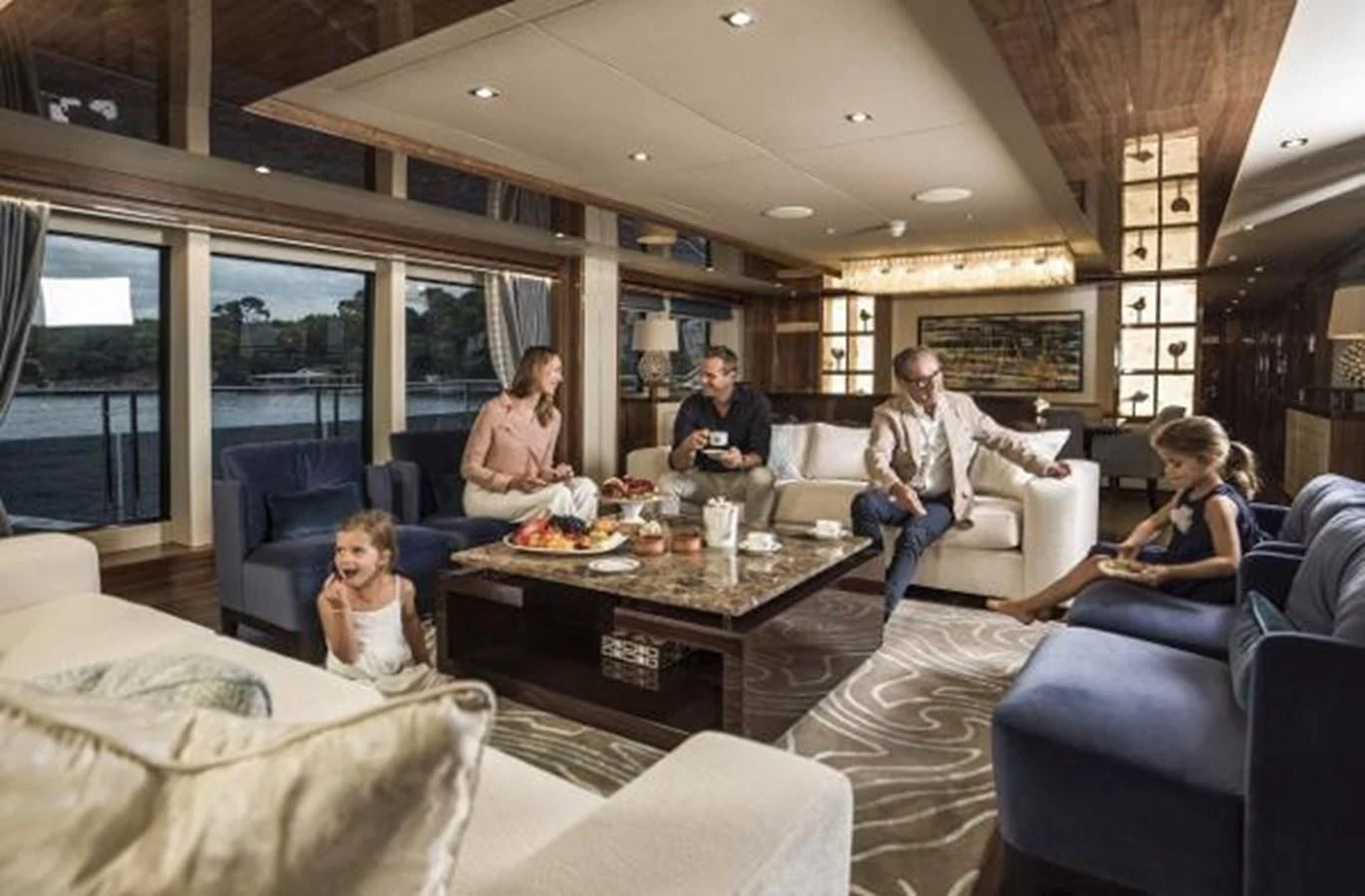 a group of people in a living room aboard ZOZO Yacht for Sale