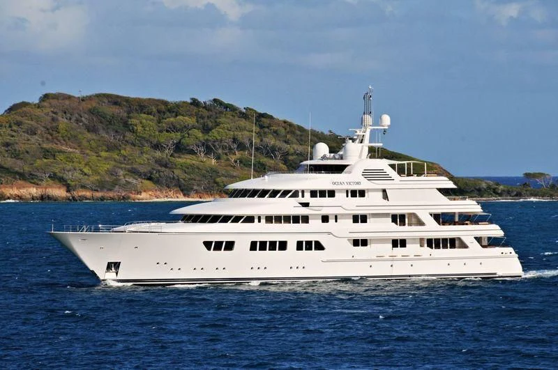 a white yacht on the water aboard EBONY SHINE Yacht for Sale