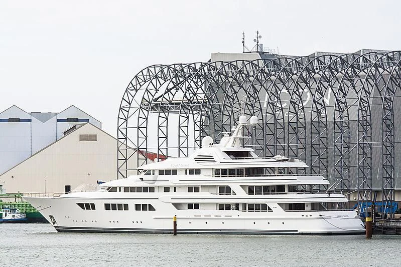 a large white boat in front of a stadium aboard EBONY SHINE Yacht for Sale