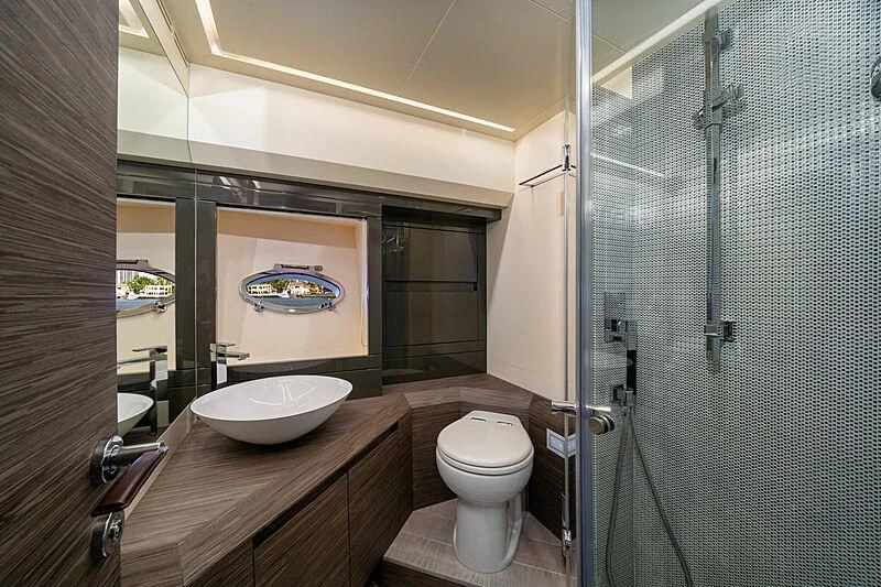 a bathroom with a sink and toilet aboard UPTOWN GIRL Yacht for Sale