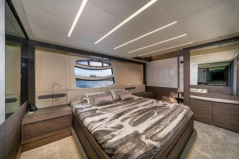a bedroom with a large bed aboard UPTOWN GIRL Yacht for Sale
