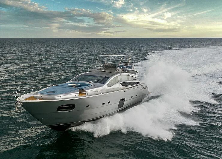 a white yacht on the water aboard UPTOWN GIRL Yacht for Sale
