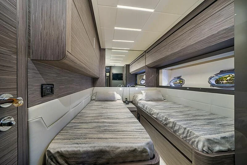 a room with a bed and a mirror aboard UPTOWN GIRL Yacht for Sale