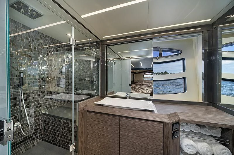 a bathroom with a large mirror aboard UPTOWN GIRL Yacht for Sale