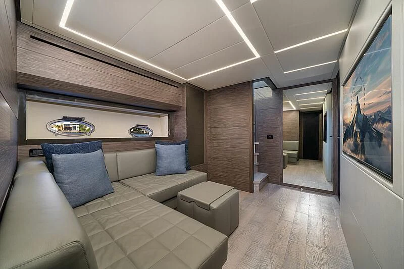 a room with a couch and a television aboard UPTOWN GIRL Yacht for Sale
