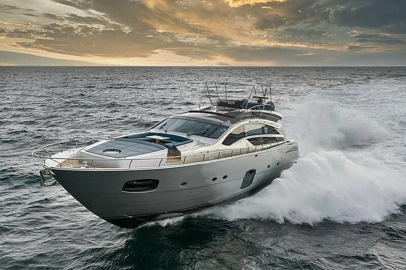 a white yacht on the water aboard UPTOWN GIRL Yacht for Sale