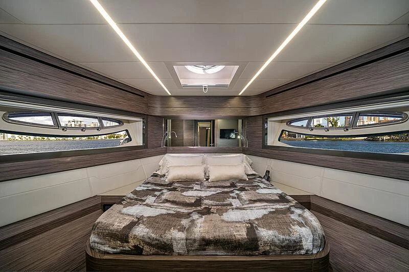 a room with a bed and a window aboard UPTOWN GIRL Yacht for Sale