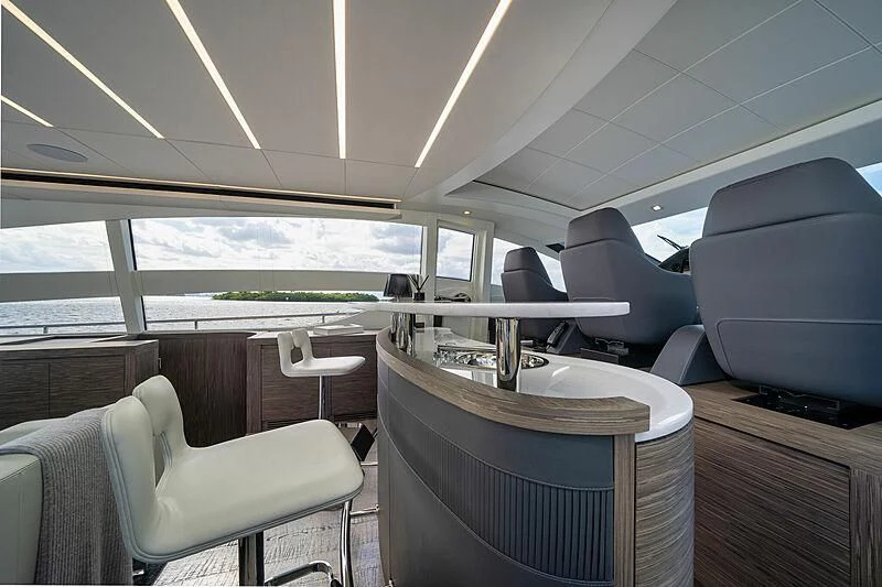 inside of a vehicle with chairs and tables and a large window aboard UPTOWN GIRL Yacht for Sale
