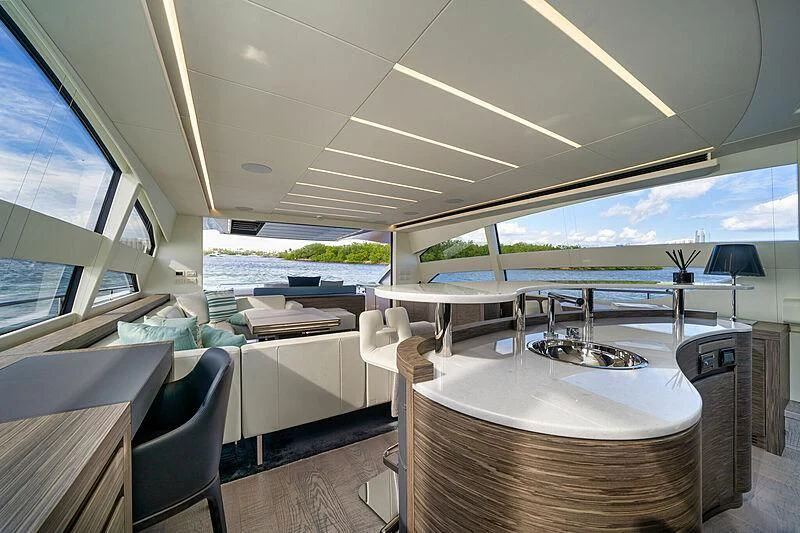 a room with a table and chairs aboard UPTOWN GIRL Yacht for Sale