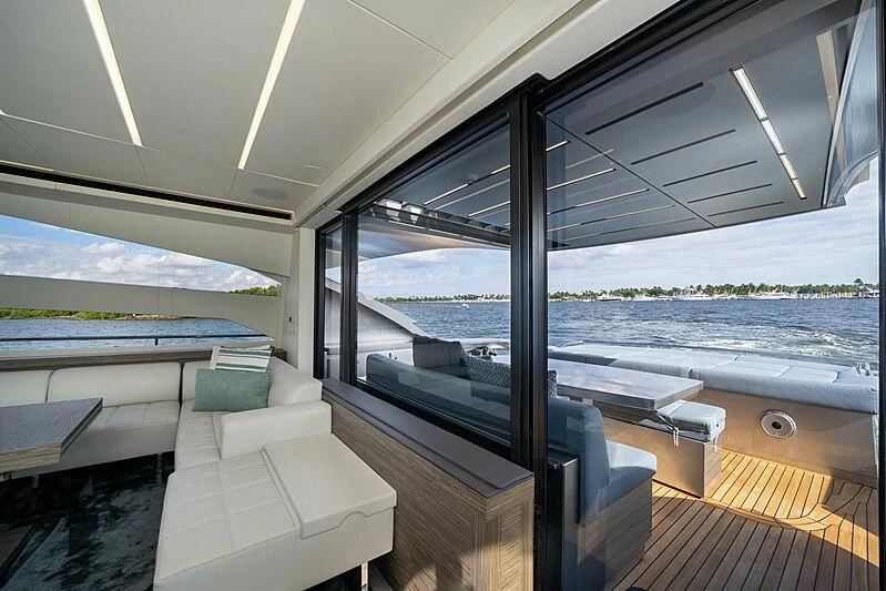a room with a view of the water and the land below aboard UPTOWN GIRL Yacht for Sale