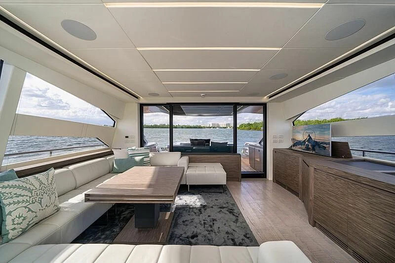 a room with a table and a couch aboard UPTOWN GIRL Yacht for Sale