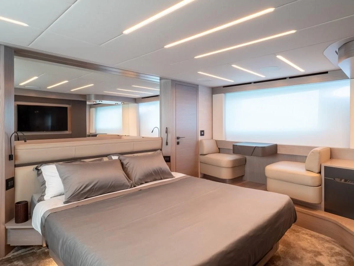 a large bedroom with a bed aboard SURVIVOR OF LONDON Yacht for Sale