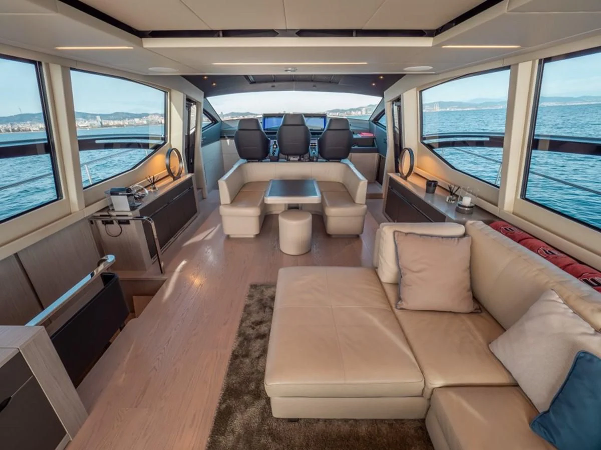 a train with a couch and a table aboard SURVIVOR OF LONDON Yacht for Sale