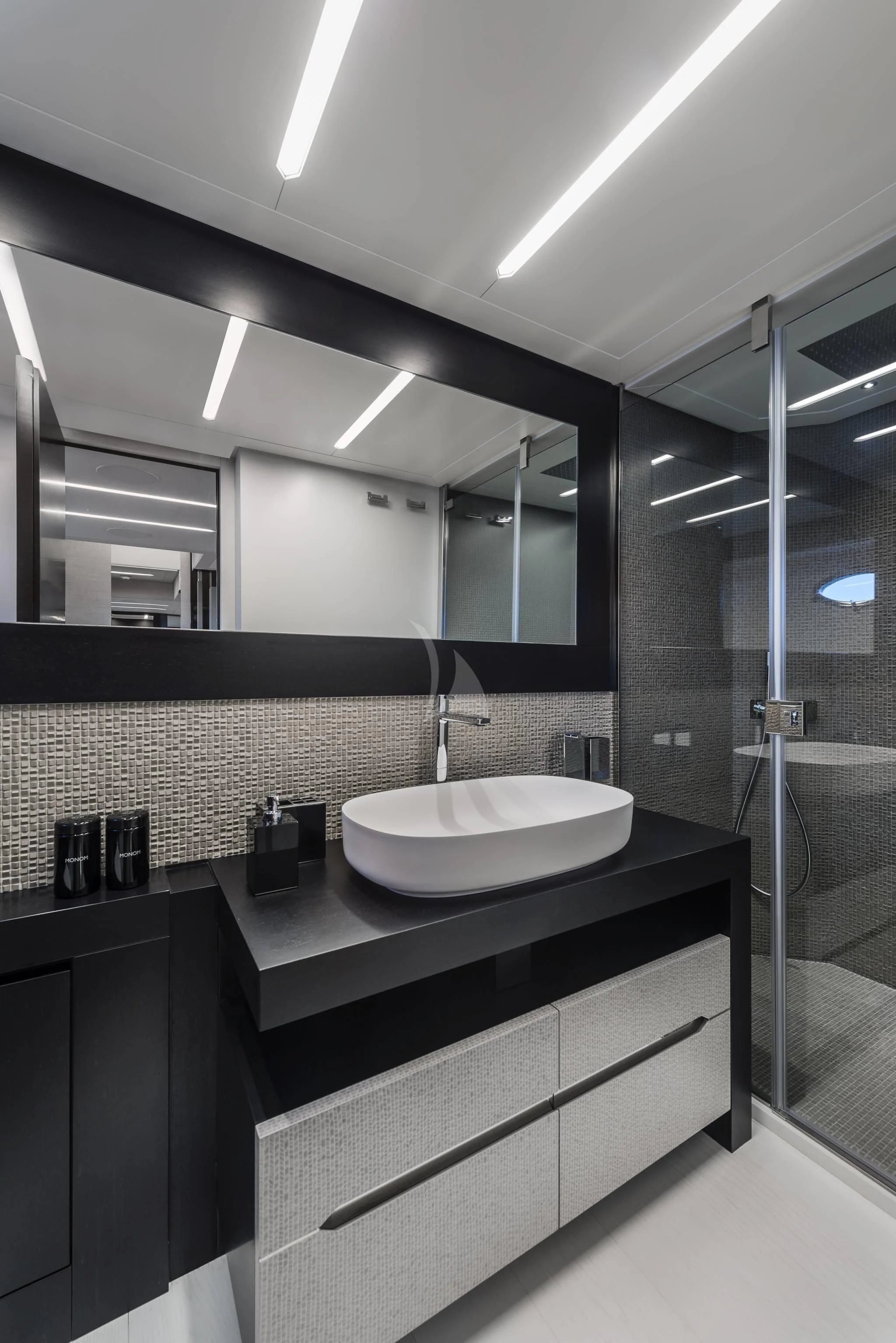 a bathroom with a sink and a mirror aboard SURVIVOR OF LONDON Yacht for Sale