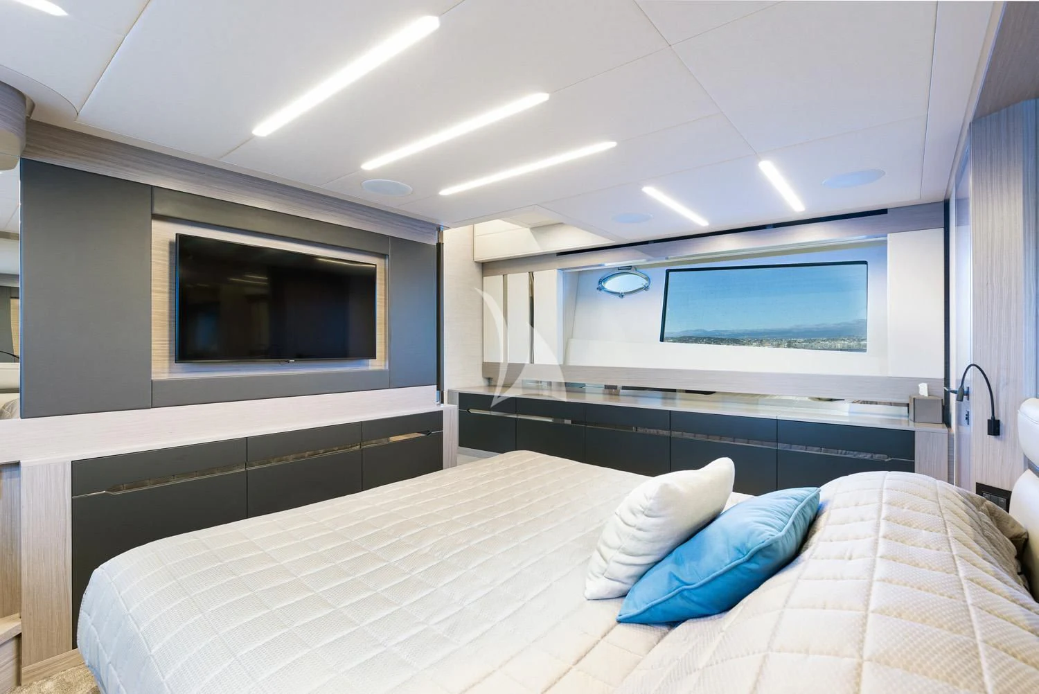 a room with a bed and a television aboard SURVIVOR OF LONDON Yacht for Sale