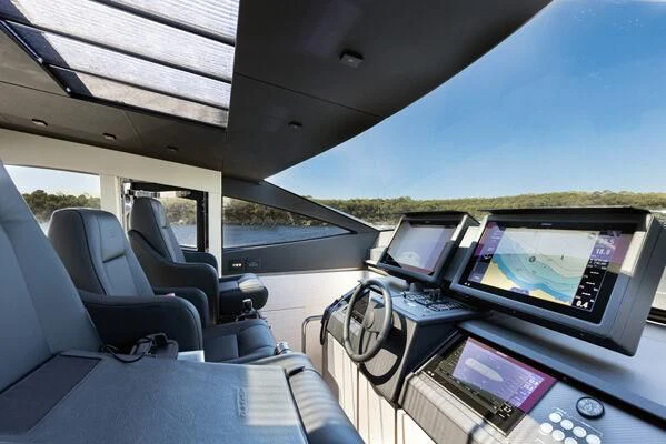 a car with a couple of monitors and a laptop on the dashboard aboard SURVIVOR OF LONDON Yacht for Sale