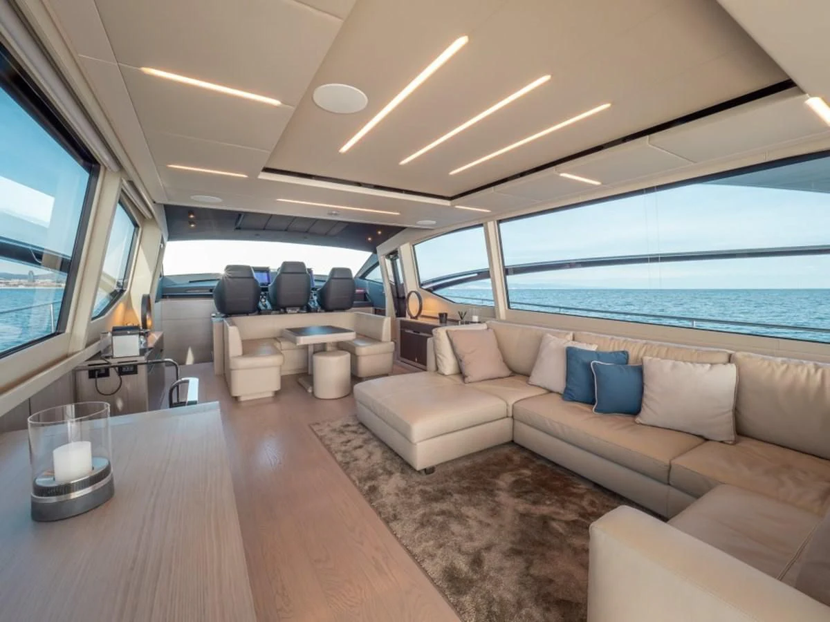 a living room with a large window aboard SURVIVOR OF LONDON Yacht for Sale