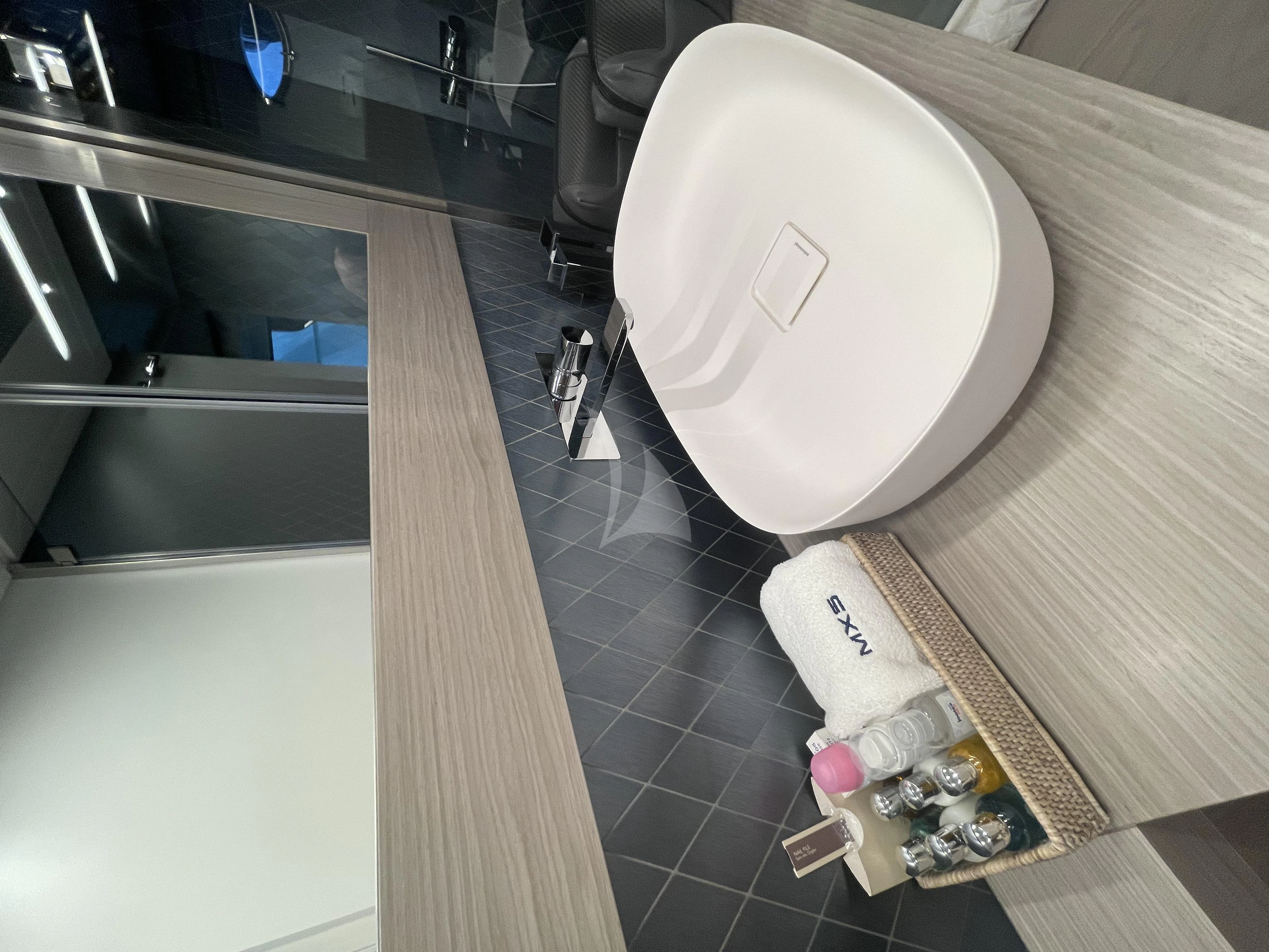 a toilet with a toilet paper on the tank aboard SURVIVOR OF LONDON Yacht for Sale