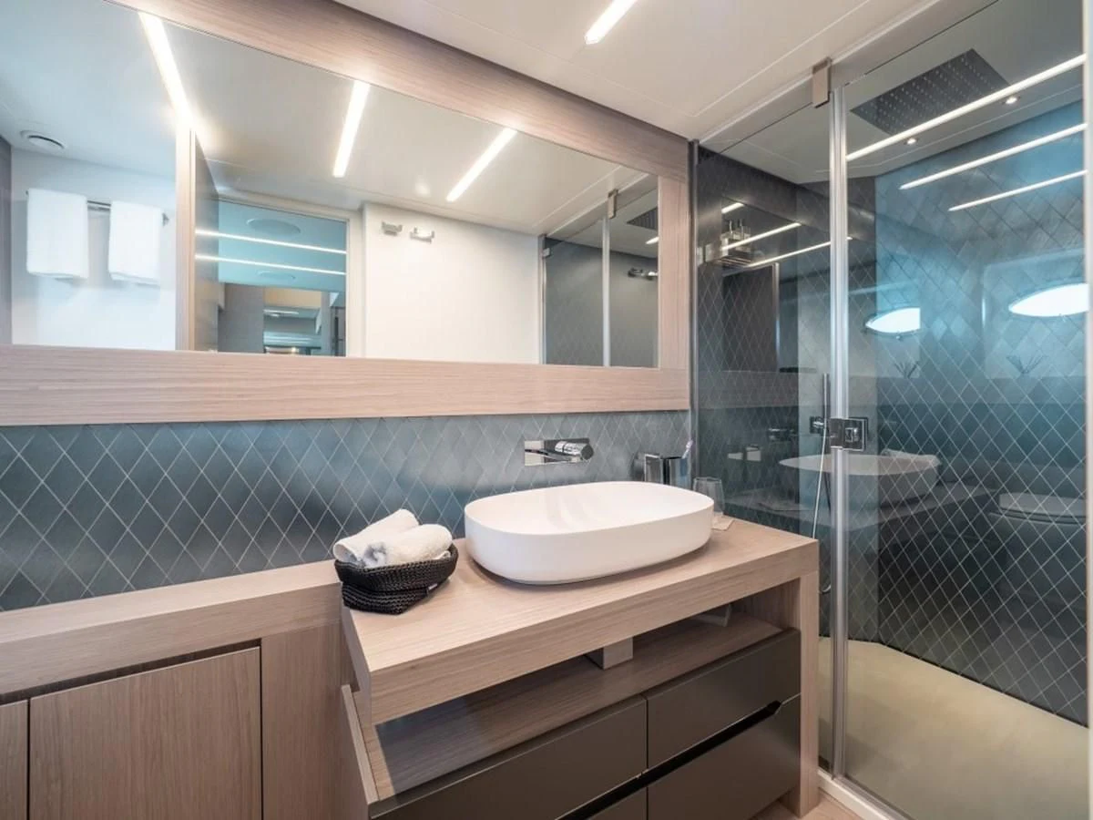 a bathroom with a glass shower aboard SURVIVOR OF LONDON Yacht for Sale