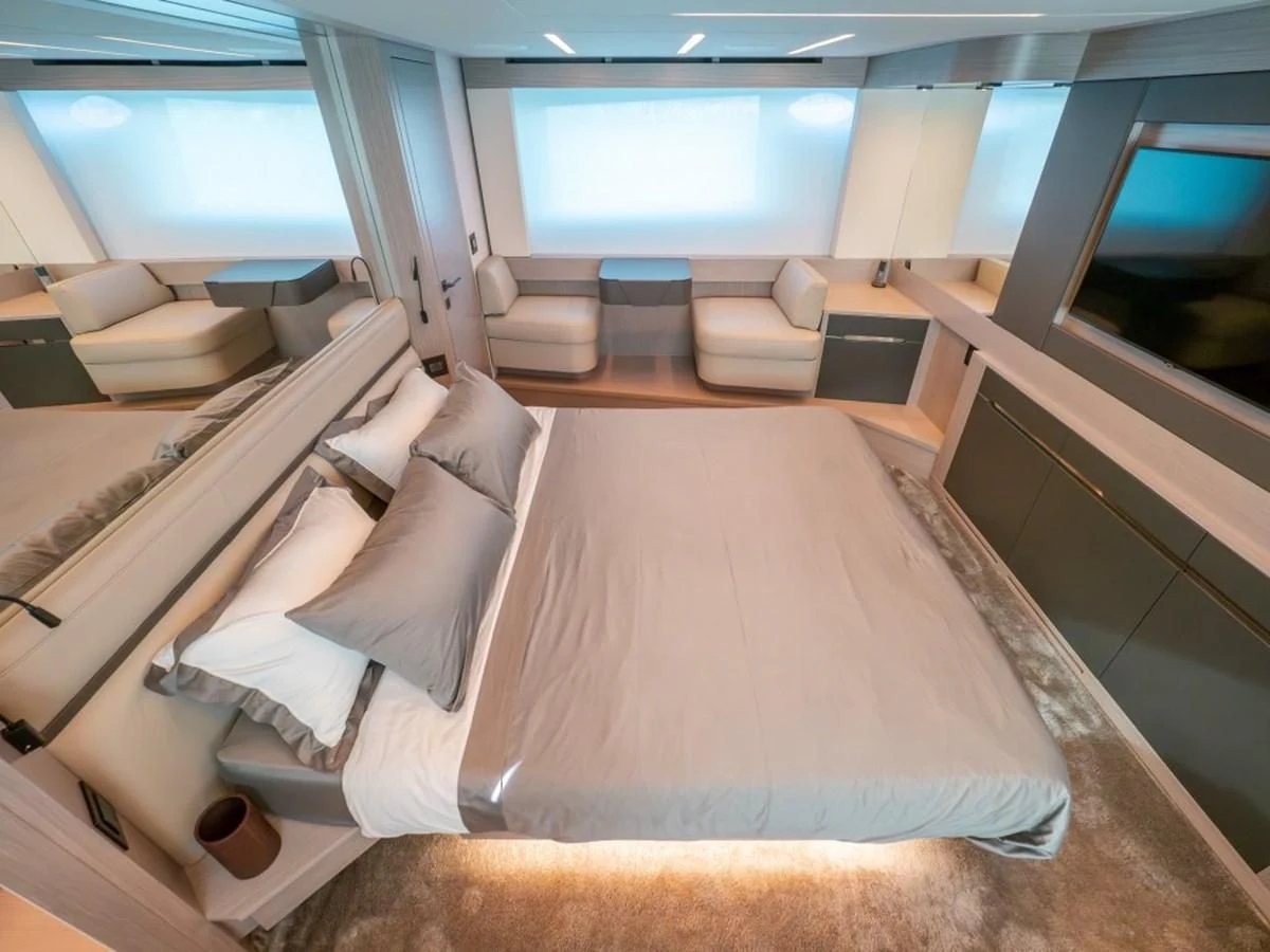 a room with a bed and a tv aboard SURVIVOR OF LONDON Yacht for Sale