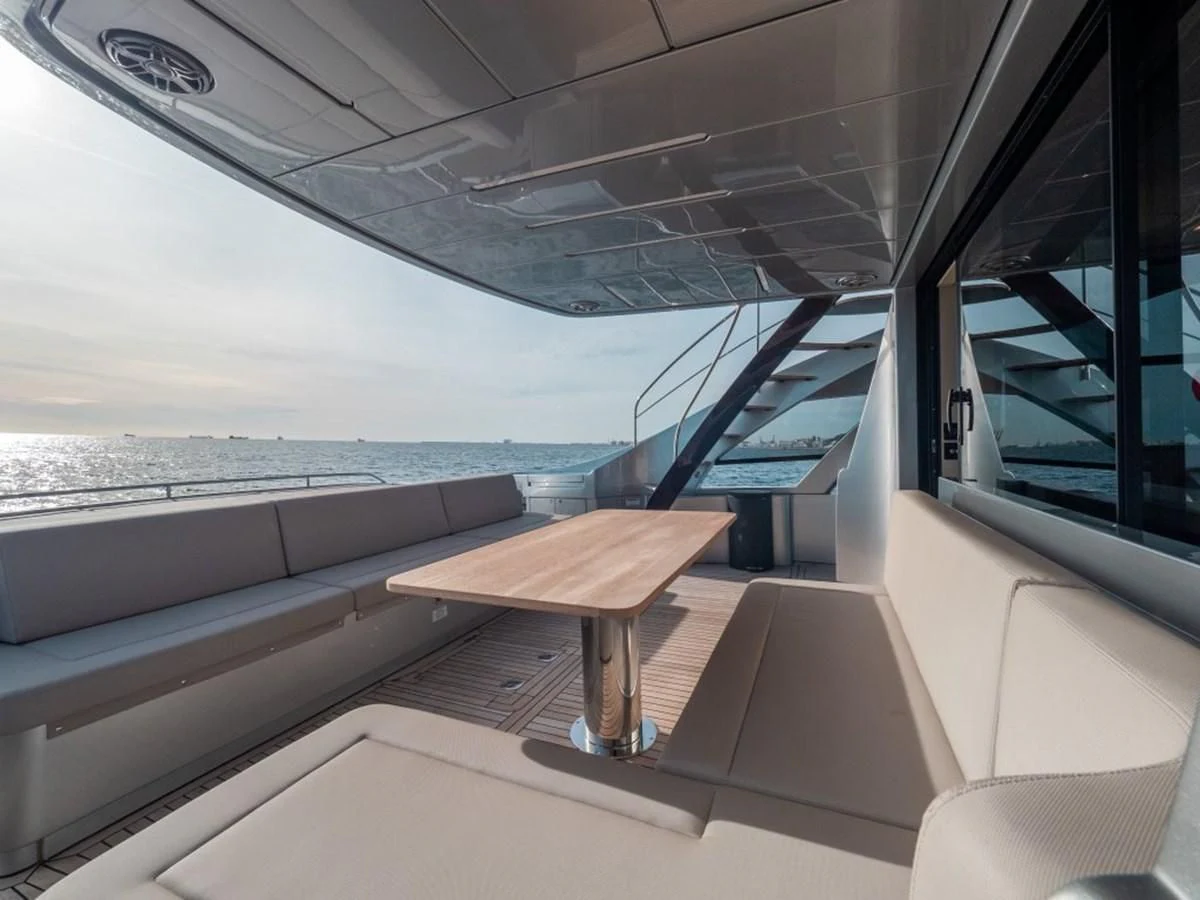 a room with a table and a bench on a boat aboard SURVIVOR OF LONDON Yacht for Sale