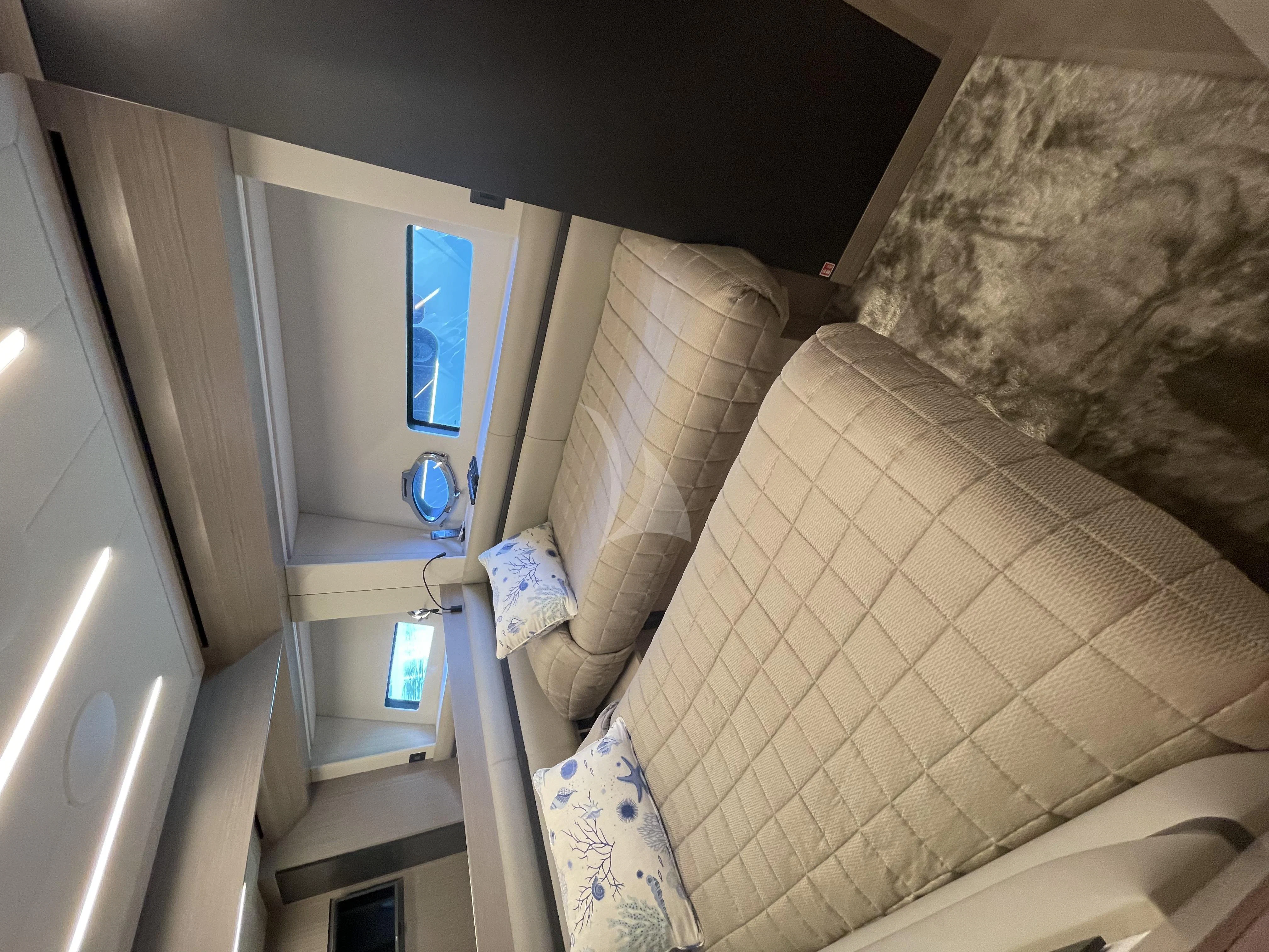 a small bathroom with a glass door aboard SURVIVOR OF LONDON Yacht for Sale