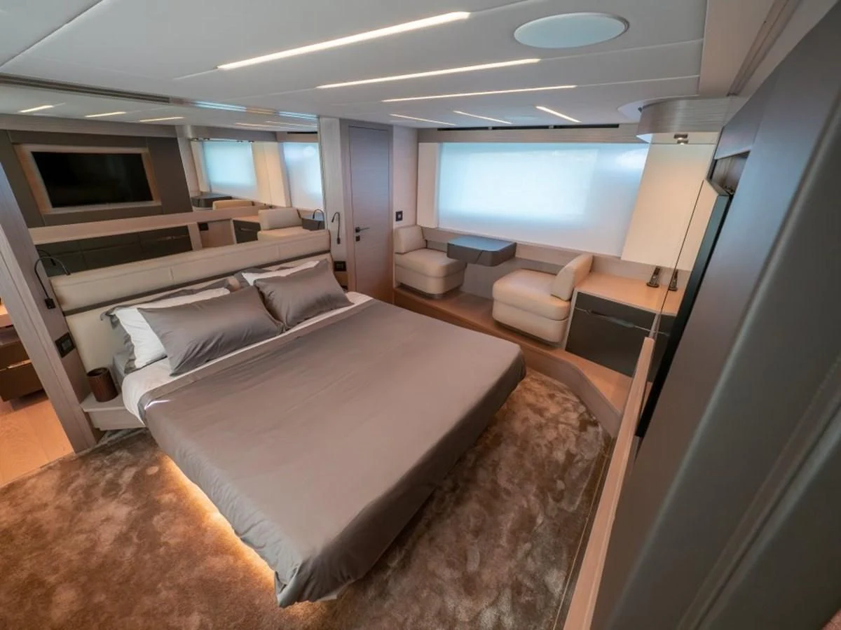 a room with a bed and a window aboard SURVIVOR OF LONDON Yacht for Sale