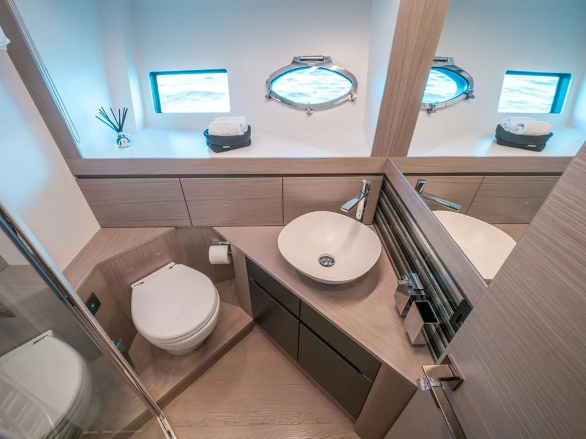 a bathroom with a sink and toilet aboard SURVIVOR OF LONDON Yacht for Sale