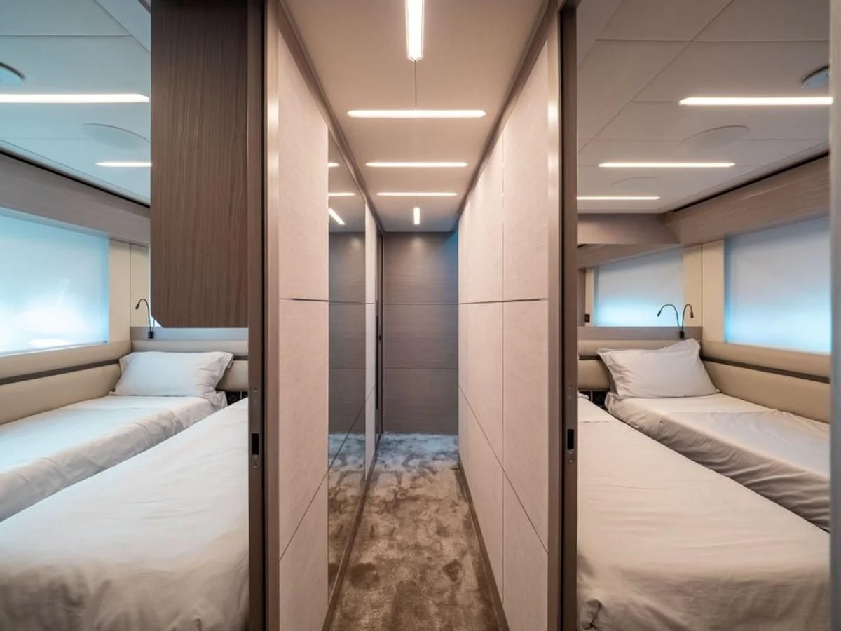 a room with a bed and a window aboard SURVIVOR OF LONDON Yacht for Sale