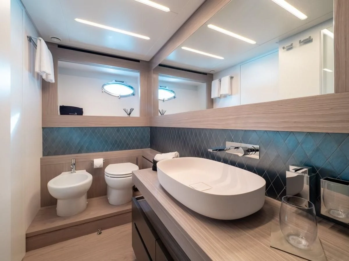 a bathroom with a sink and a toilet aboard SURVIVOR OF LONDON Yacht for Sale
