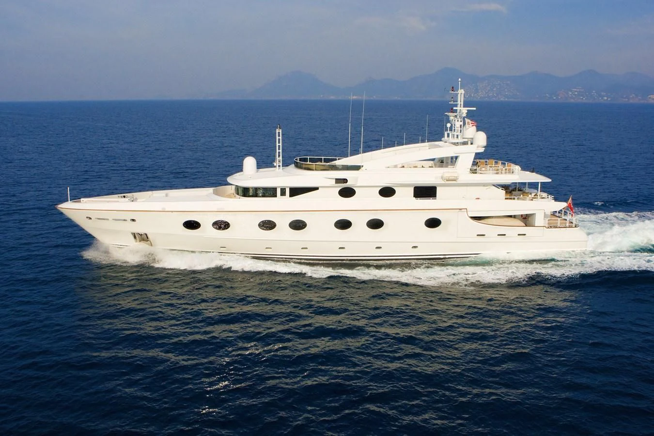 a white boat on the water aboard QUEEN AIDA Yacht for Sale