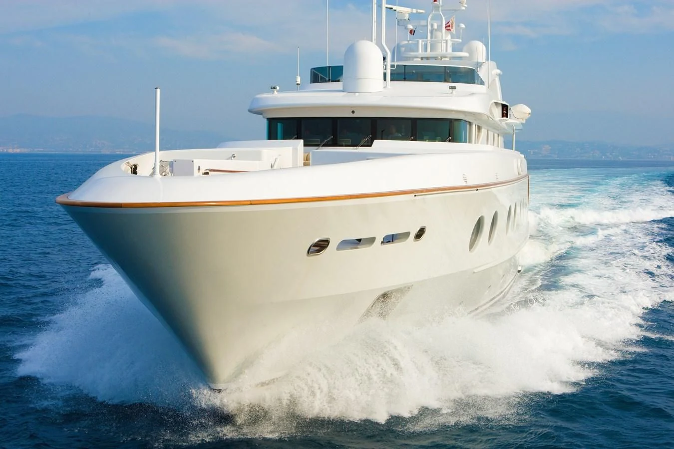 a white boat on water aboard QUEEN AIDA Yacht for Sale