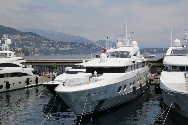 a group of boats are parked in a harbor aboard QUEEN AIDA Yacht for Sale