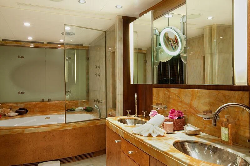 a bathroom with a large mirror aboard QUEEN AIDA Yacht for Sale