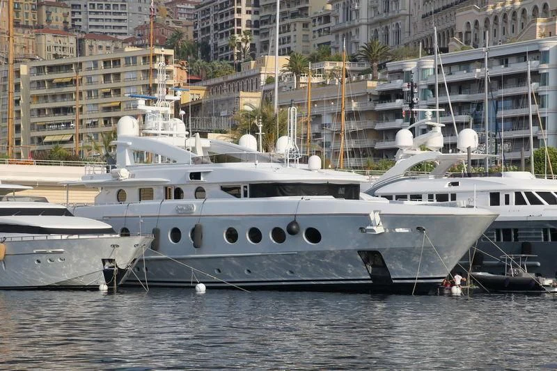 a couple of boats sit in a harbor aboard QUEEN AIDA Yacht for Sale