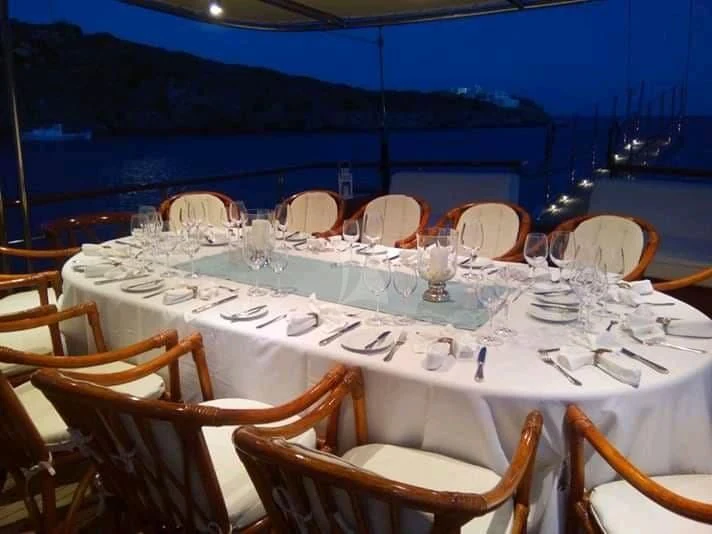 a table set for a dinner aboard IRAKLIS L Yacht for Charter