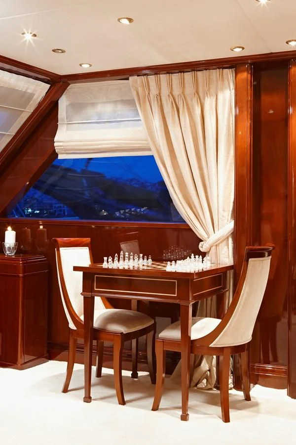 a room with a table and chairs aboard IRAKLIS L Yacht for Charter