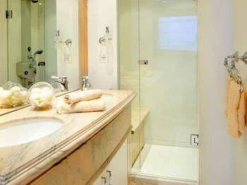 a bathroom with a sink and a bathtub aboard IRAKLIS L Yacht for Charter