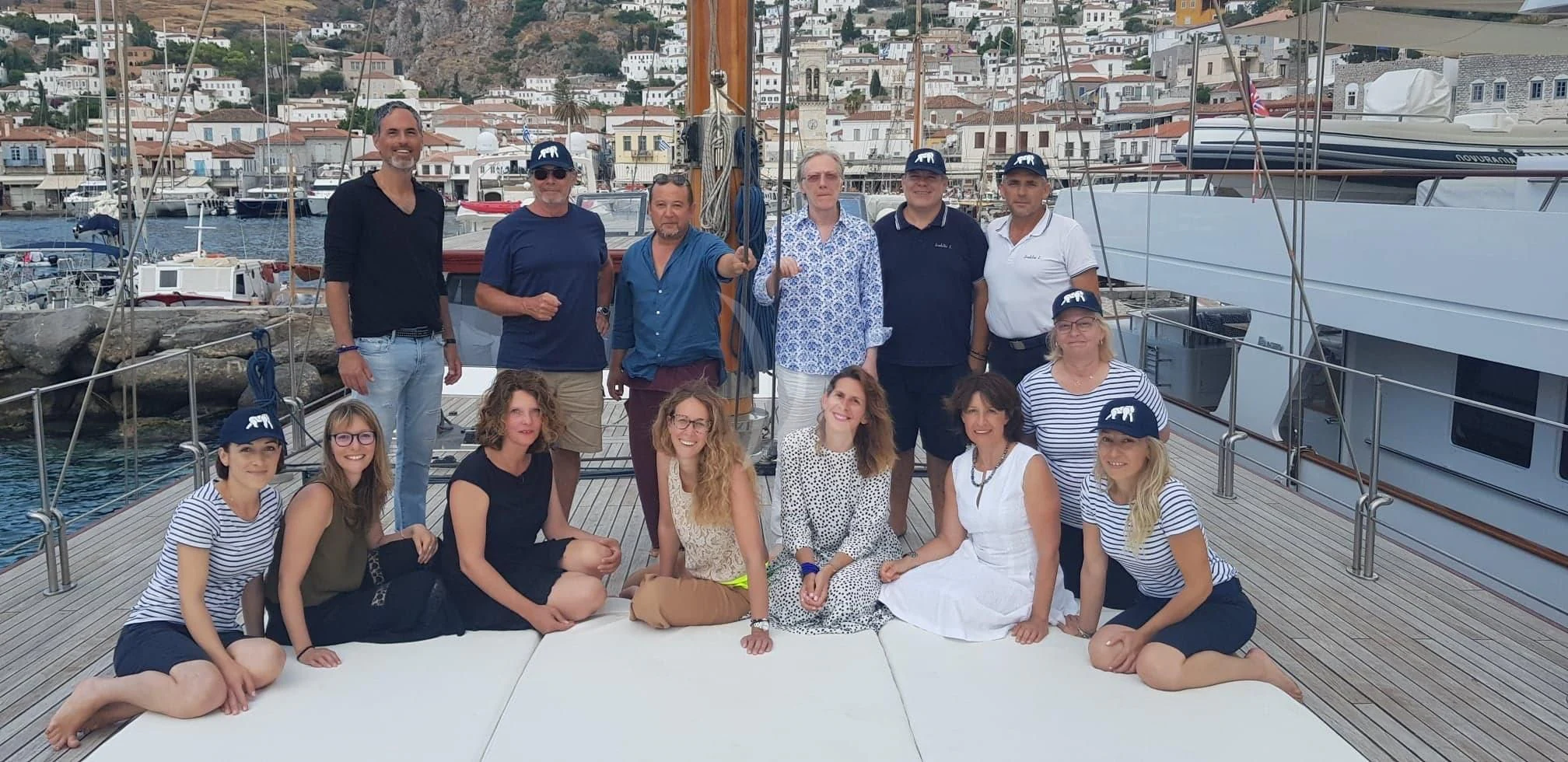 a group of people posing for a photo aboard IRAKLIS L Yacht for Charter