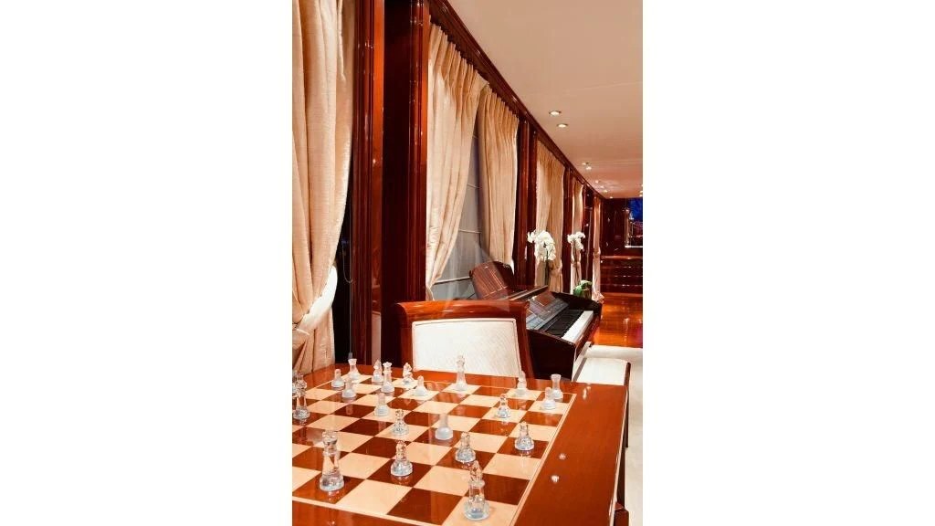 a room with a table and chairs aboard IRAKLIS L Yacht for Charter