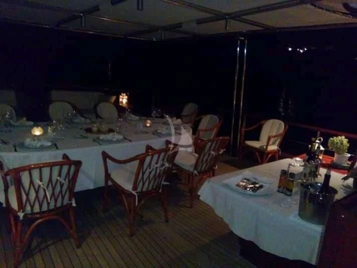 a table set for a dinner party aboard IRAKLIS L Yacht for Charter
