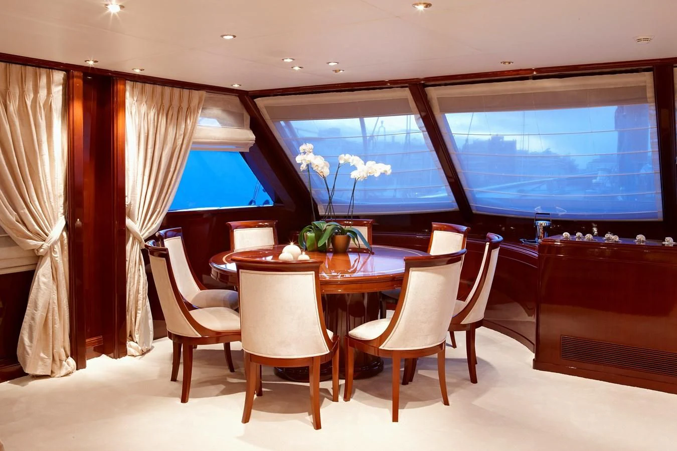 a room with a table and chairs aboard IRAKLIS L Yacht for Charter